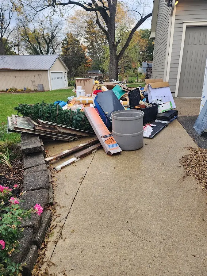 Dumpster being loaded with debris for Commercial Dumpster Rental in Eaton